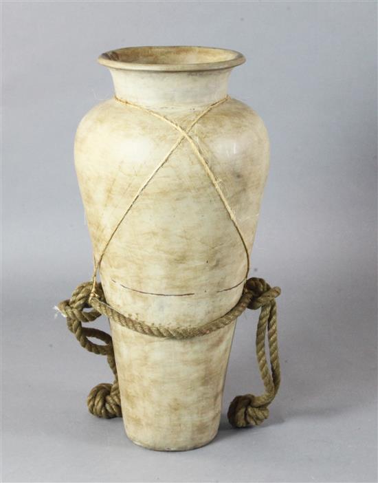 A large pottery urn shaped pot used as a classical stage prop